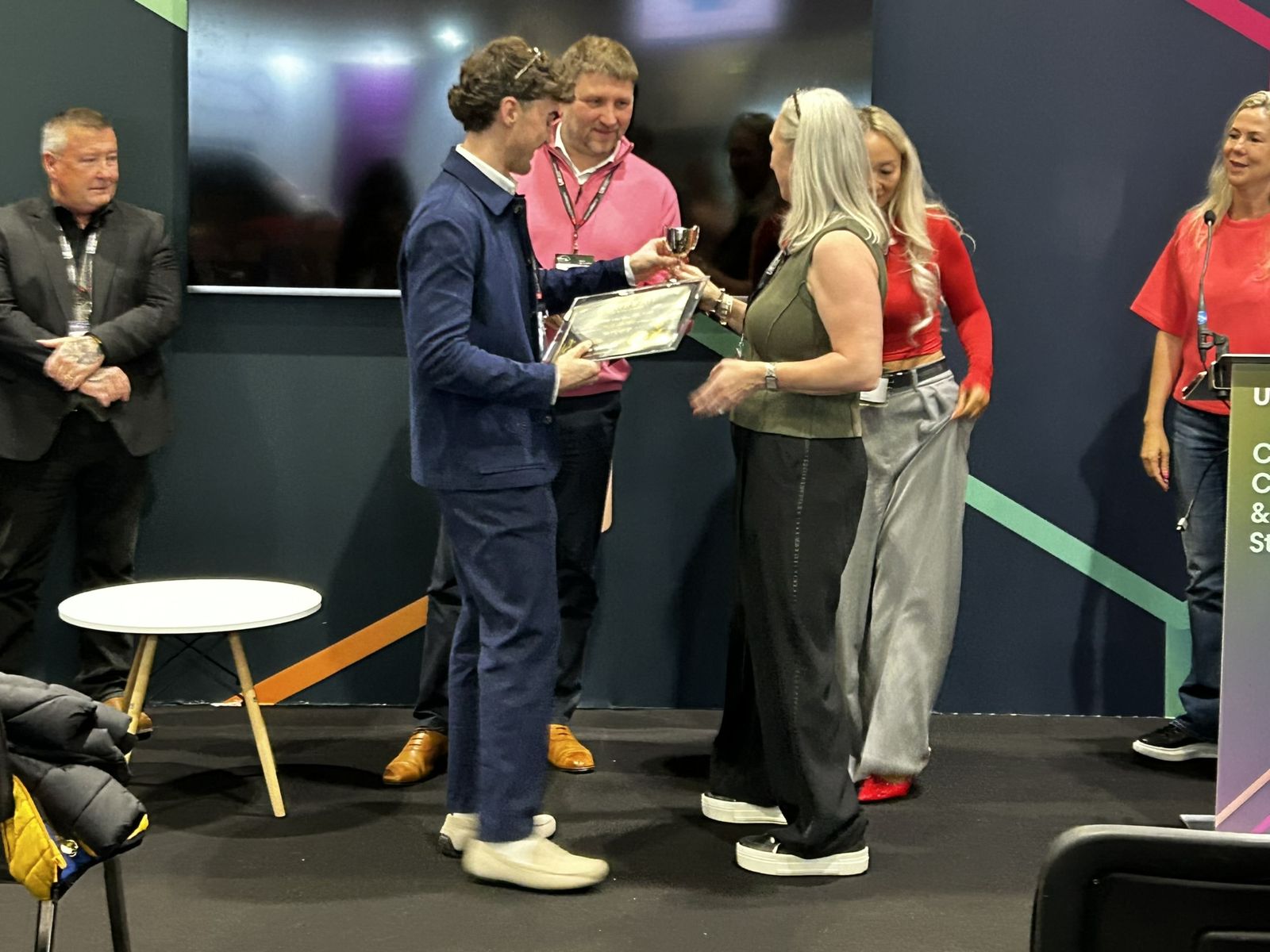 Lindsay and Lewis being presented with the award on the Culture Change & Skills Stage